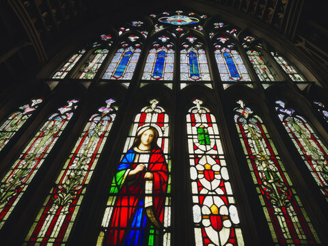 Digital photo of a Gothic medieval stained glass window in a Catholic church.