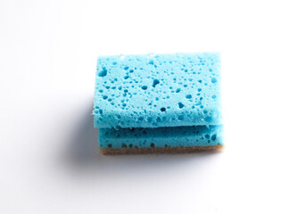 leaning sponge on white background