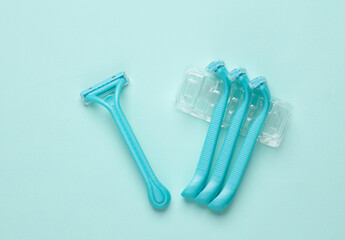 Set of plastic razors on a paper background