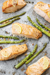 Baked Delicious salmon, green asparagus and lemon in pan