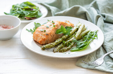 Baked Delicious salmon, green asparagus on  plate