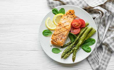 Baked Delicious salmon, green asparagus on  plate