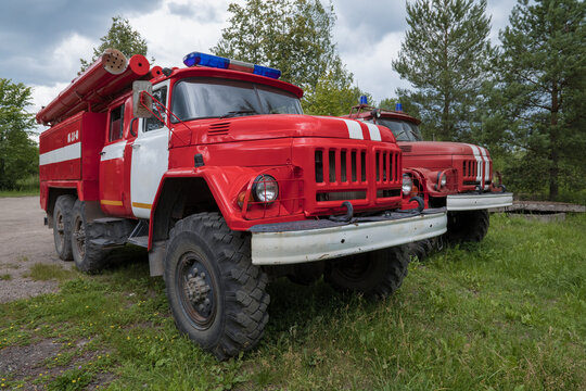 NOVGOROD REGION, RUSSIA - JULY 15, 2023: Fire truck AC3.0-40 (Amur-531320) based on ZIL-131 car close-up on a cloudy July day