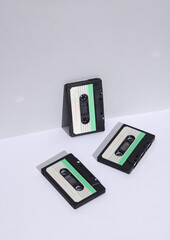 Retro 80s audio cassettes on white background with shadow. Creative layout, minimalism, music lover