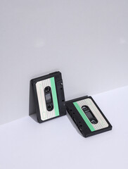 Retro 80s audio cassettes on white background with shadow. Creative layout, minimalism, music lover