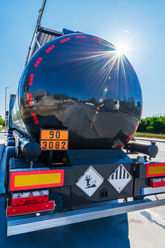Tanker truck for the transport of dangerous goods under ADR regulations, rear view.