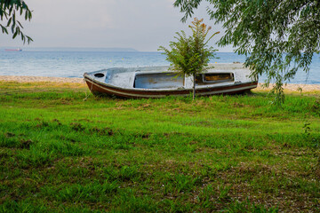abandoned fisherman boat on beach