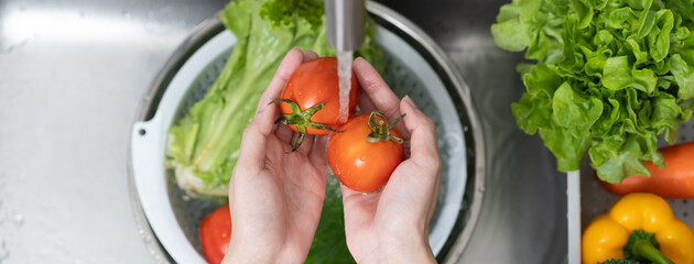 people washing raw vegetables at sink in the kitchen prepare ingredient for cooking
