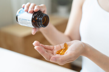 Cultivating Wellness: A Person Embraces the Benefits of Fish Oil Supplements for Optimal Health and Vitality
