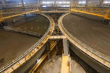 Large round floatation machine tank full of liquid at plant