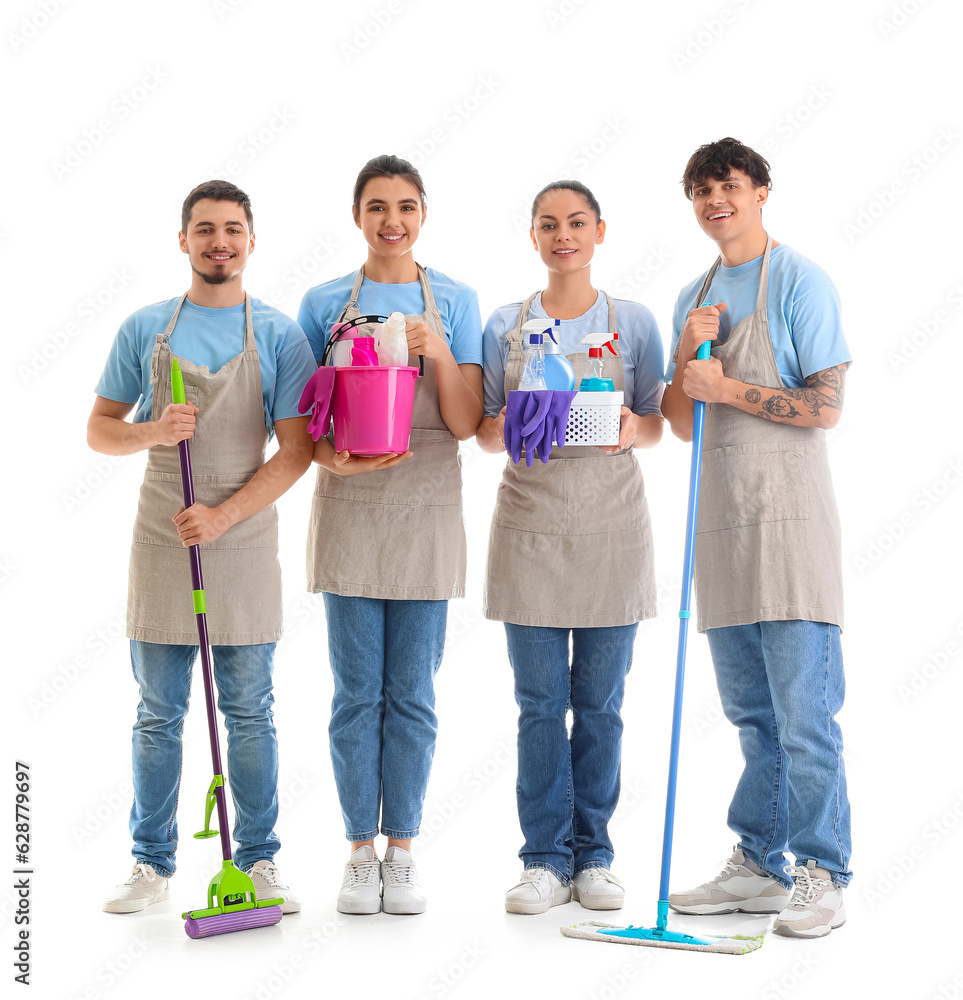 Canvas Prints Young janitors with cleaning supplies on white background