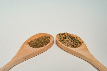 Wooden spoons filled with spices in different positions