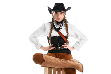 Young cowgirl sitting on white background