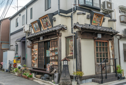 Taito Ward, Tokyo, Japan - August 18, 2017: Beautiful facade of Yanaka Emadou traditional restaurant decorated with ema hanging plaques located in Yanaka district.