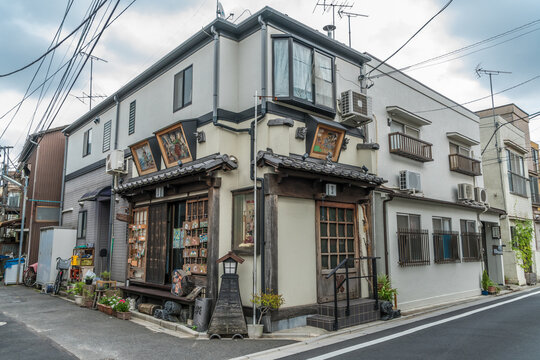 Taito Ward, Tokyo, Japan - August 18, 2017: Beautiful facade of Yanaka Emadou traditional restaurant decorated with ema hanging plaques located in Yanaka district.
