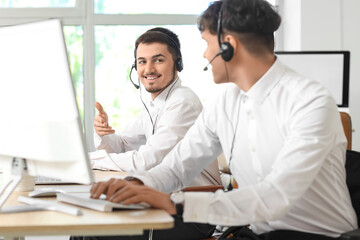 Male technical support agents  working in office