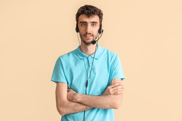 Male technical support agent on beige background