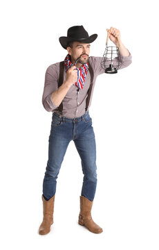 Handsome cowboy with lantern and smoking pipe on white background
