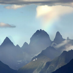 Mountain peaks, rainbows, staggered peaks, some clouds
