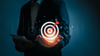 Businessman hand showing dart board icon, concept of target and goal  success How to work...