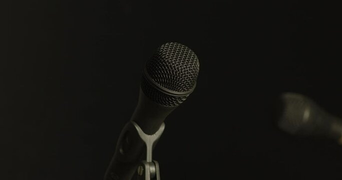 Microphones transition from light to obscurity elegantly