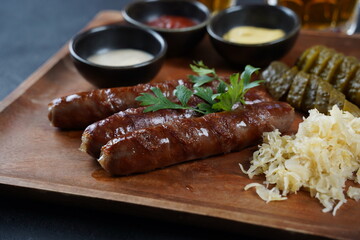 Fried sausages from Nuremberg with sauerkraut and horseradish Bavarian beer garden meal