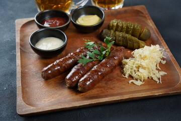 Fried sausages from Nuremberg with sauerkraut and horseradish Bavarian beer garden meal