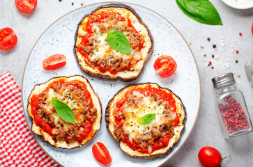 Eggplant Pizza with Tomato Sauce, Minced Meat, Mozzarella and Basil, Mini Vegetable Pizza over Bright Background