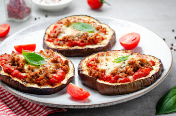 Eggplant Pizza with Tomato Sauce, Minced Meat, Mozzarella and Basil, Mini Vegetable Pizza over Bright Background