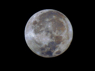 Obraz premium Supermoon on July 4, 2023 : The Buck Moon. Image saturation was processedto display moon color