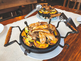 Traditional national Bulgarian dish of sach from meat and vegetables.