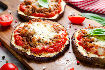 Eggplant Pizza with Tomato Sauce, Minced Meat, Mozzarella and Basil, Mini Vegetable Pizza over Bright Background