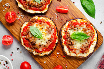 Eggplant Pizza with Tomato Sauce, Minced Meat, Mozzarella and Basil, Mini Vegetable Pizza over Bright Background