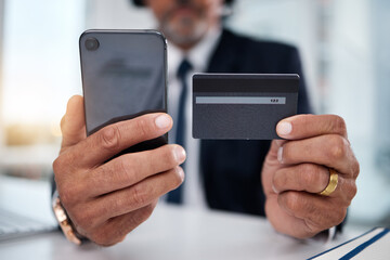Hands, phone and credit card man in office for payment, ecommerce or budget for shopping in call center. Consultant, crm and banking in closeup for loan, fintech or bills in telemarketing workplace