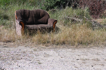 sofa thrown away illegal dump