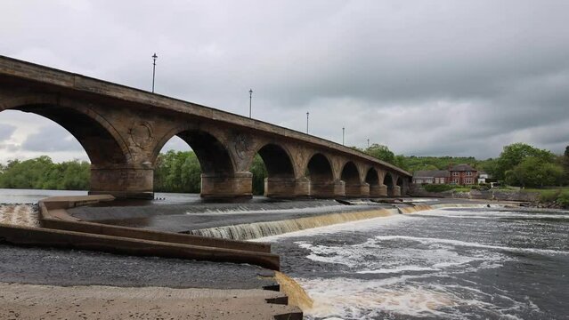 Old Stone Bridge With Arches Across the River