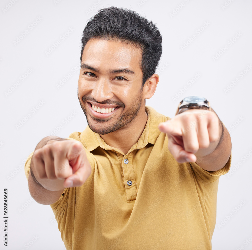 Poster portrait, smile of asian man and pointing to you in studio isolated on a white background. face, hap