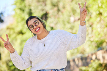 Peace sign, woman and portrait with a smile outdoor of student on summer holiday and vacation. Motivation, gen z and emoji v hand gesture feeling silly with freedom and female person from Morocco - obrazy, fototapety, plakaty