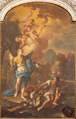 NAPLES, ITALY - APRIL 22, 2023:The painting of archangel Raphael with the Tobias  in the church...