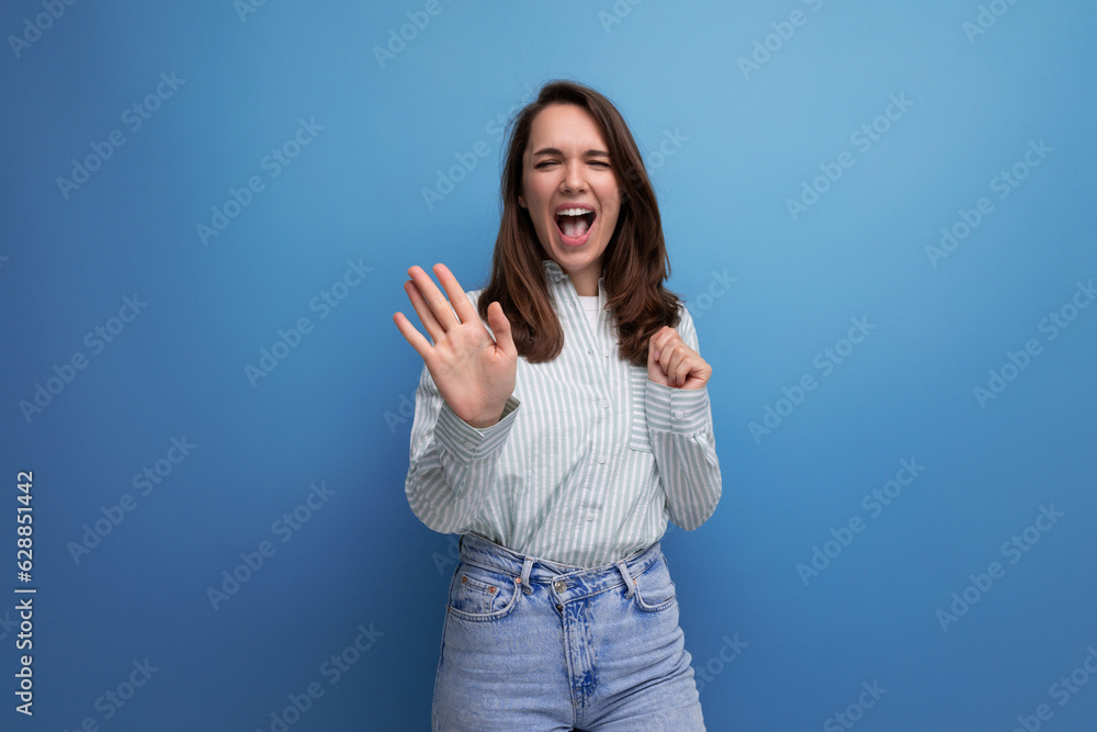 Sticker 25 year old brown-haired female person laughing out loud on a blue background