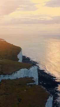 Beautiful aerial over the white cliffs of Dover near Old Harrys Rocks on the south coast of England. 
Aerial vertical,&nbsp;vertical video background. 