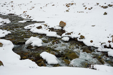 mountain creek river in winter with snow and ice. High quality photo