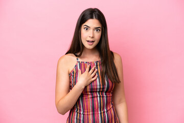 Young Brazilian woman isolated on pink background pointing to oneself