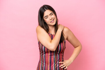 Young Brazilian woman isolated on pink background suffering from pain in shoulder for having made an effort