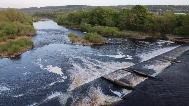 View of a Full-Water River With a Dam