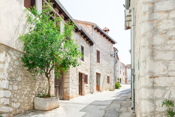 Medieval street with old houses on an early summer morning