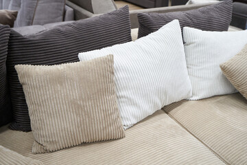 Soft pillows and a sofa made of corduroy fabric