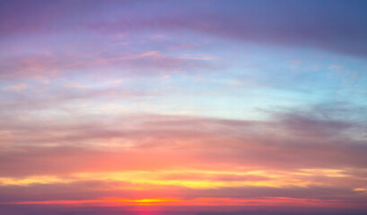 Gentle ligth colors of sunrise sundown sky with pastel  light  clouds, real sky