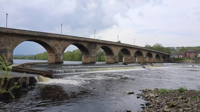 View of the Old Stone Bridge With Arches Across the River