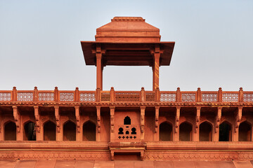 Decorative buildings and walls inside of Agra red fort in India, beautiful architecture elements of ancient indian building, red fort in Agra built of red sandstone, Lal Qila historical building - obrazy, fototapety, plakaty